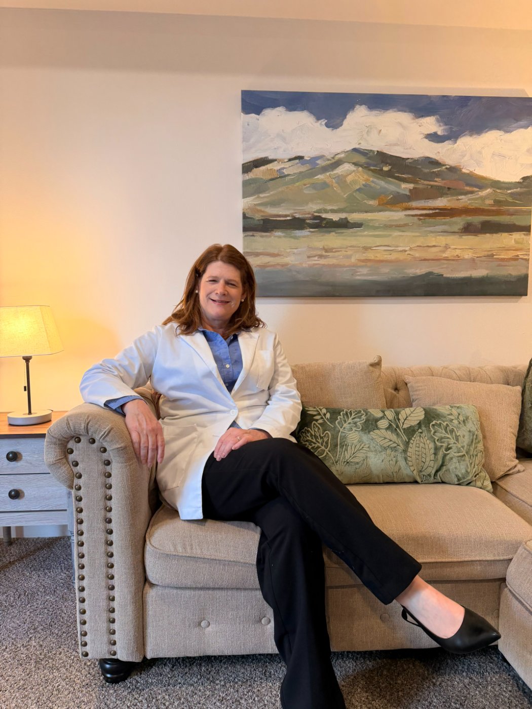 Lavena McCullum, PMHNP-BC, seated in the MindHealth Psychiatry office — founder of the practice.